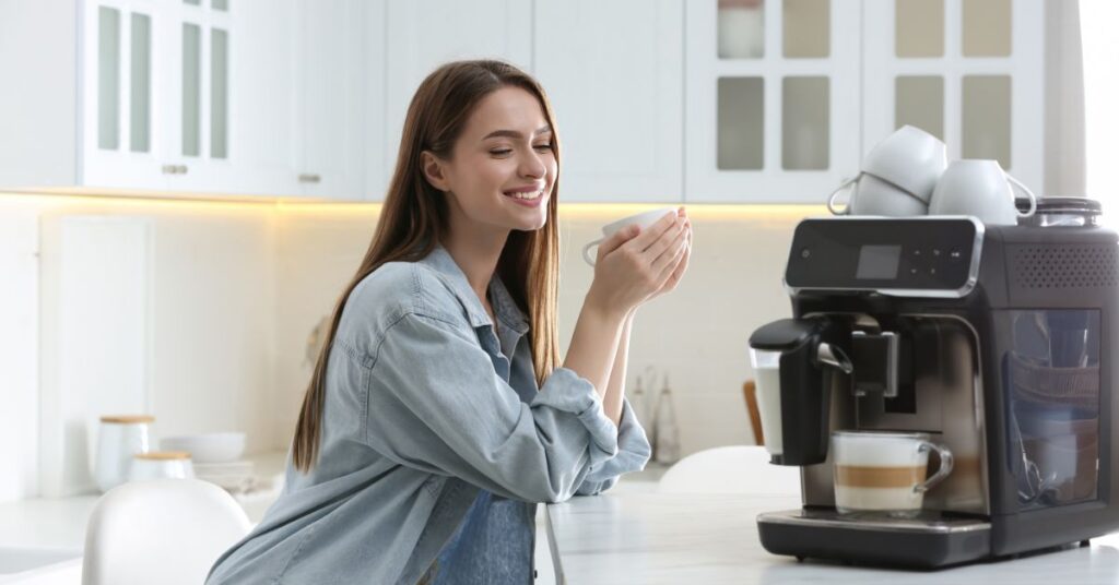 bean to cup coffee machine - lady enjoying a cup of coffee